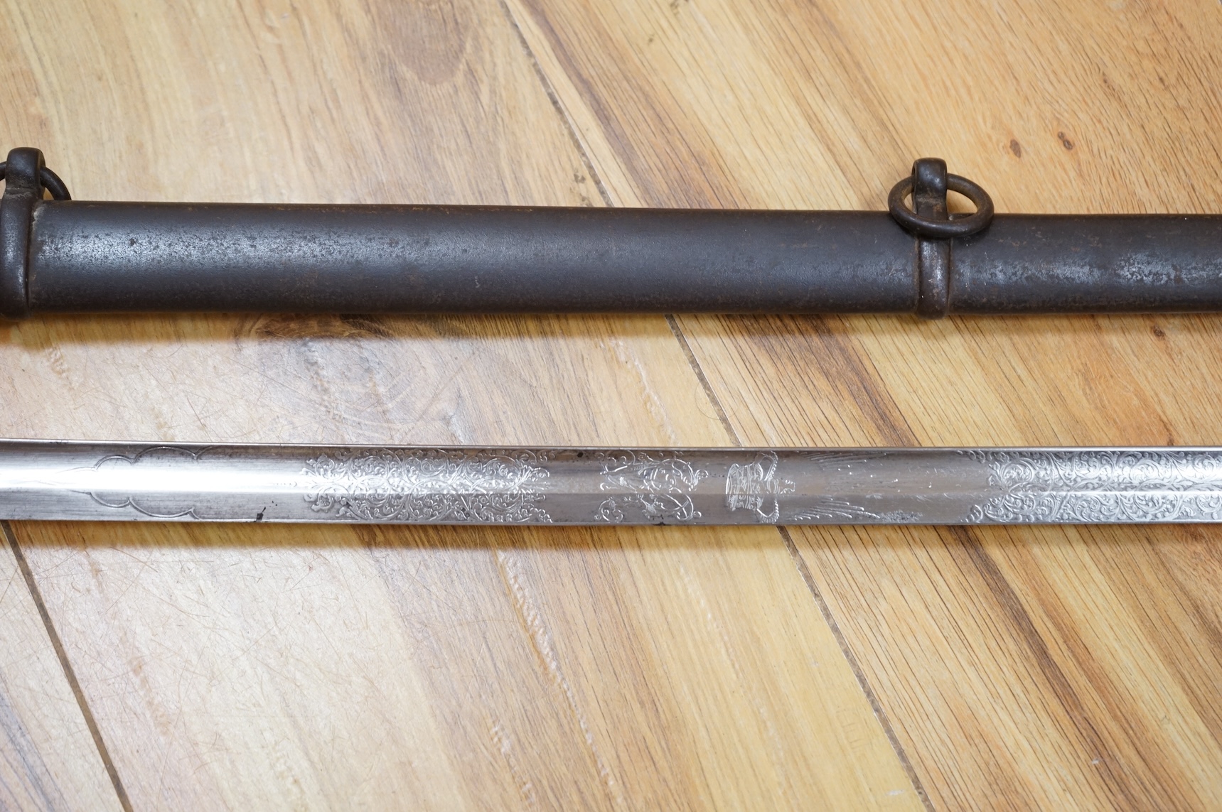 A Victorian 1845 pattern infantry officer’s levee sword, with slender blade etched; Hamburger Rogers & Co., and crowned VR and foliage, regulation pierced brass guard with folding side guard, wire bound fish skin covered